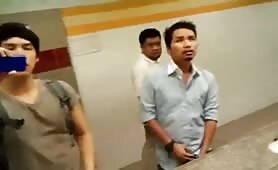 Asian guy cuming in a public bathroom